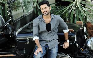 Nithiin looks dashing in the latest photoshoot with a black Jeep